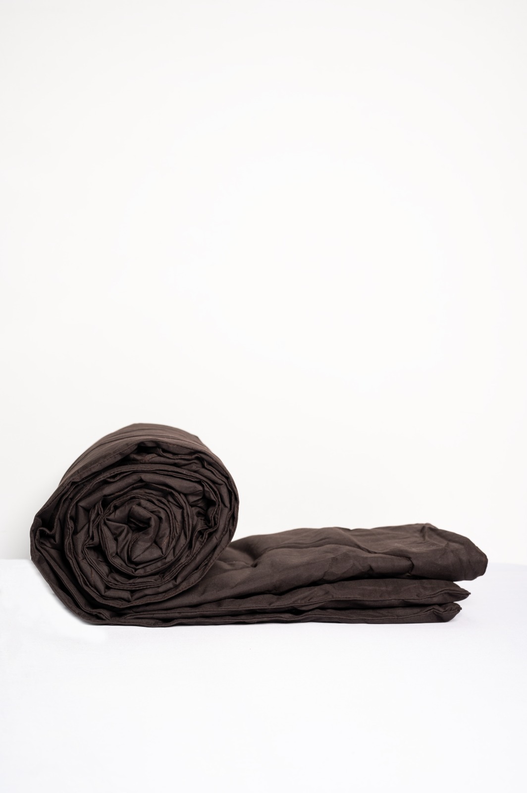 Rolled brown comforter